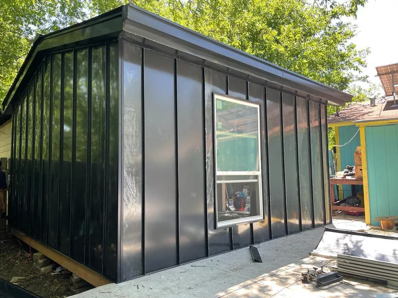 Black standing seam metal wall panels for Roof Inspection in Madera