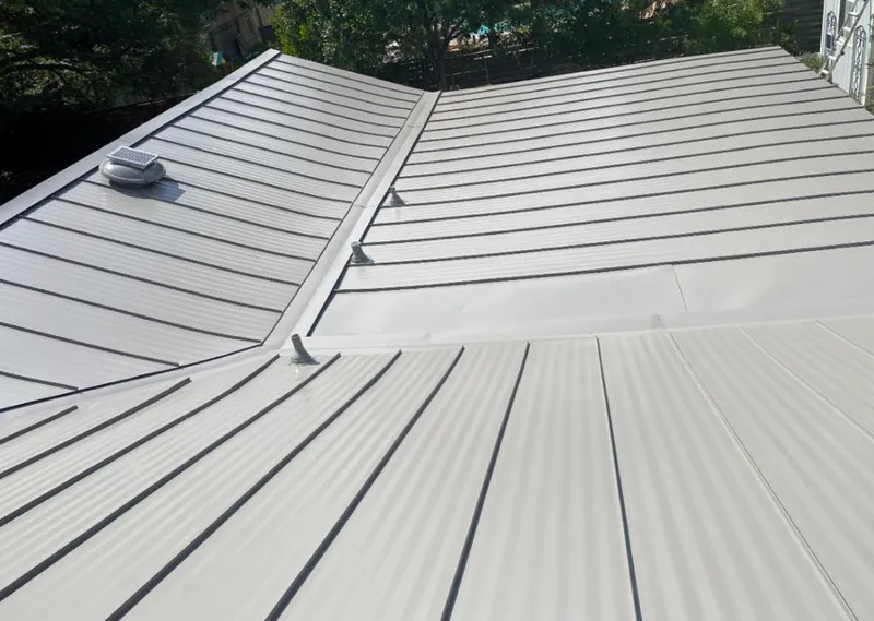 Solar attic fan installed on a metal roof for Roof Ventilation in Madera